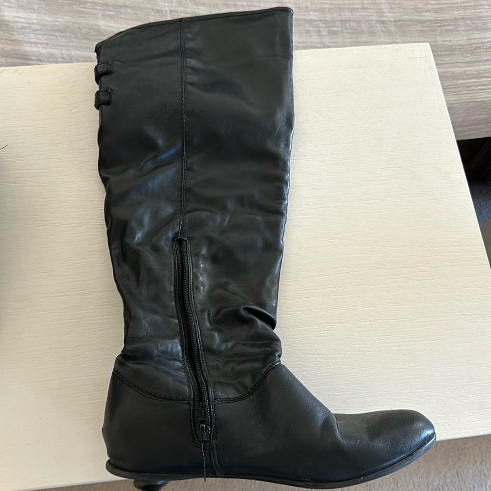 Black knee high boots.